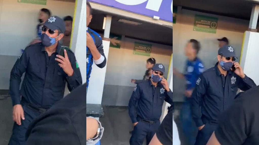 En plena riña, policía habla por teléfono en el Querétaro vs Atlas (Video)